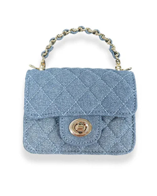 Small quilted handbag made of light blue denim fabric with a diamond stitch pattern, featuring a gold-tone twist-lock closure on the front flap and a short handle with interwoven blue material and gold chain links.