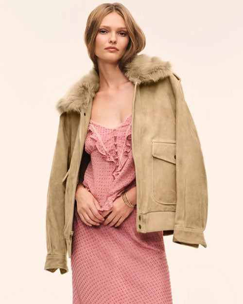 Pink ruffle-trim slip dress paired with a beige suede jacket featuring a faux-fur collar.