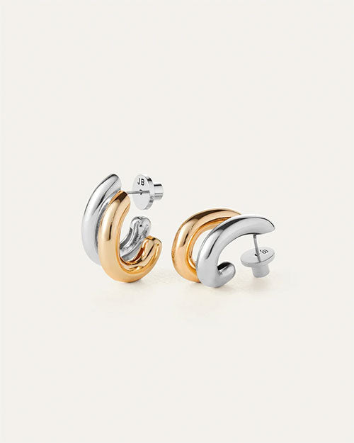 Pair of modern stud earrings featuring interlocking curved hoops in polished gold and silver tones, with post-back closures.