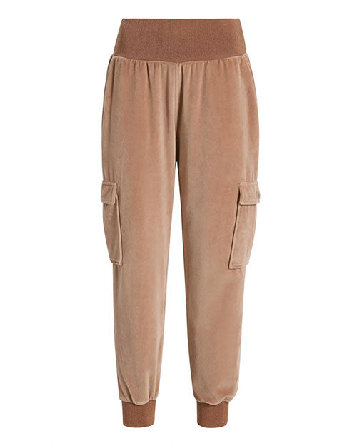 Front view of light brown velvet jogger-style pants featuring a wide ribbed waistband, ribbed cuffs, and two side cargo pockets with flap closures.