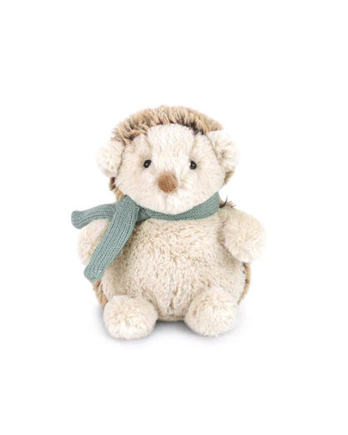 A plush hedgehog toy with soft beige fur and darker brown spines along the back. It has a round, cuddly body, small ears, and a brown nose. The hedgehog is accessorized with a knitted green scarf wrapped around its neck, giving it a cozy, winter-themed appearance.