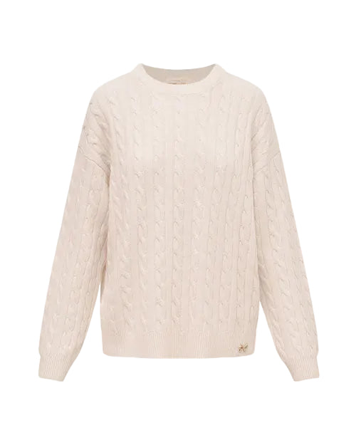 Cream-colored cable-knit sweater with long sleeves, a ribbed crew neckline, and a relaxed fit. The sweater features a textured cable pattern throughout and a small decorative emblem near the hem.