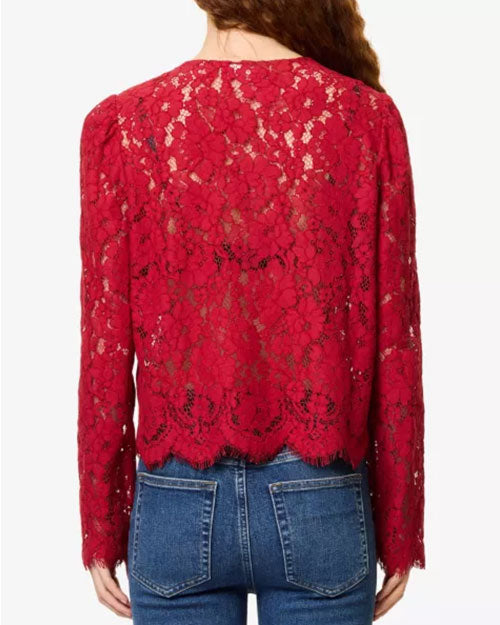Red floral lace cardigan-style top with a round neckline, button-front closure, and scalloped hem, paired with blue jeans against a light gray background.