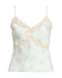 Light green satin camisole with thin straps, floral print, and lace-trimmed V-neckline and empire seam.
