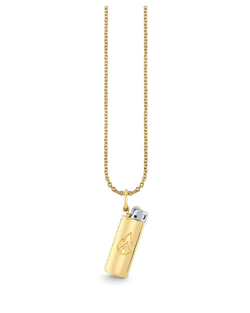 Gold necklace with a delicate chain and a pendant shaped like a lighter, featuring an engraved flame symbol and a silver-colored top.