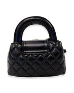 Back view of a small black quilted handbag with rounded handles and a plain design without embellishments.