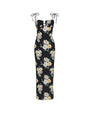 Black sleeveless maxi dress with thin tie straps and a large floral print featuring white and light yellow flowers with green leaves.