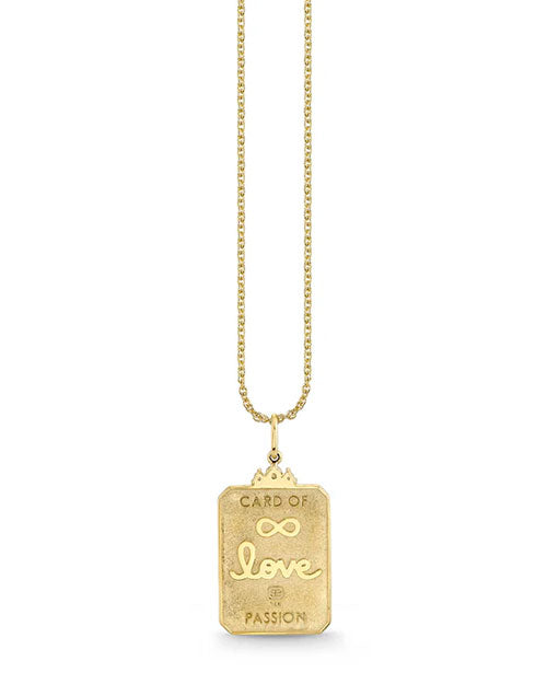 Gold necklace with a rectangular pendant engraved with “CARD OF” at the top, an infinity symbol, the word “love” in cursive, and “PASSION” at the bottom, hanging from a delicate gold chain.