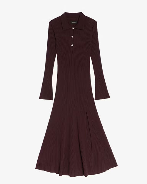 A long-sleeve, ribbed knit dress in a deep burgundy color. The dress features a collared neckline with a partial button placket of three buttons, a fitted bodice, and a flared hemline. It also has a subtle slit on one side near the bottom. The fabric appears to have a textured, vertical rib pattern.
