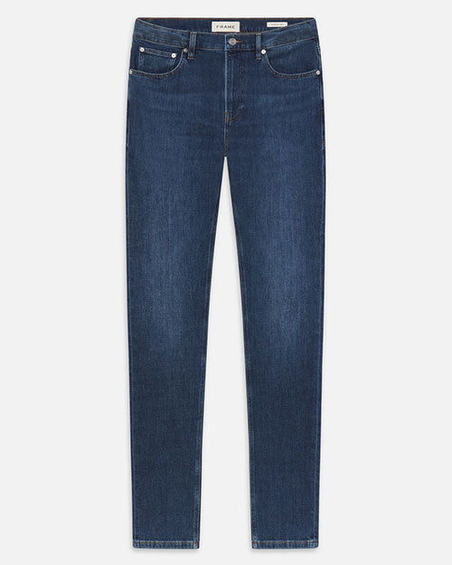 Product image of dark-wash blue denim jeans displayed flat against a light background, featuring a mid-rise waist, classic five-pocket styling with metal rivets, belt loops, a front button and zip closure, and straight, slim legs with subtle fading throughout.