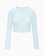 Light blue pointelle knit cardigan with scalloped edges and button front closure. 