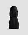 Black sleeveless mini dress with a gathered high neckline and fitted skirt