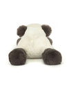 Plush toy of a panda bear lying on its stomach with head facing away, featuring white body fur and black ears, arms, and legs.