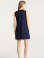 Back view of a sleeveless navy shift dress with a straight silhouette and a hidden back zipper.