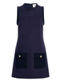 Sleeveless navy shift dress with a round neckline and two front flap pockets with gold button details.