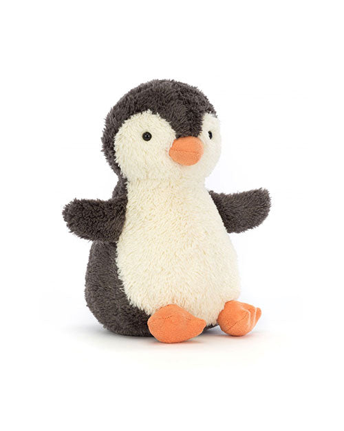 Plush penguin toy with soft, fluffy dark grey fur on its back, wings, and head, white belly and face, and orange beak and feet.