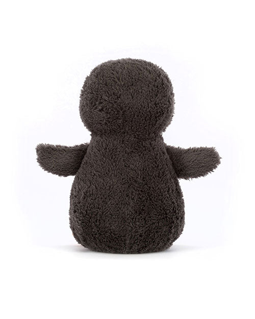  Back view of a dark gray plush toy with a rounded head, plump body, and two short arms extended outward. The toy has a soft, fuzzy texture.