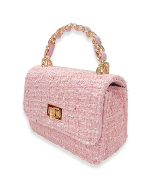 Angled view of a small rectangular pink tweed handbag embellished with sequins, featuring a gold-tone twist-lock closure and a braided top handle.