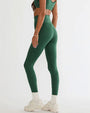 Person wearing a matching green textured sports bra and leggings set