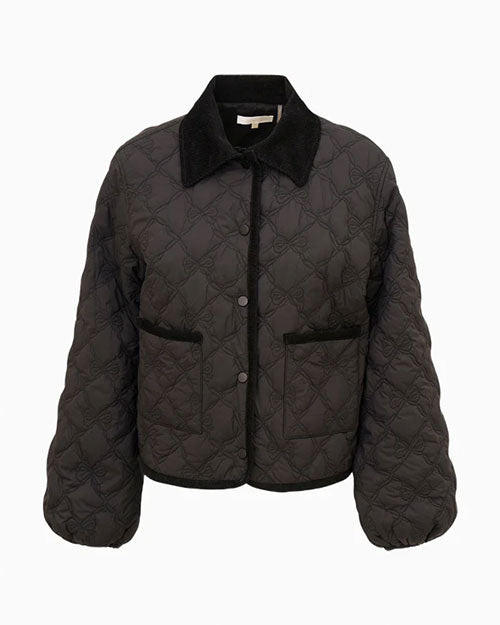 Front view of a black quilted jacket featuring a diamond-pattern stitch design, snap-button closure, two front pockets, and a pointed collar with a contrasting soft texture.
