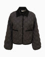 Front view of a black quilted jacket featuring a diamond-pattern stitch design, snap-button closure, two front pockets, and a pointed collar with a contrasting soft texture.
