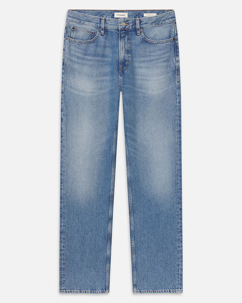 Product image of light-wash blue denim jeans displayed flat against a light background, featuring a mid-rise waist with belt loops, a button and zip closure, and classic five-pocket styling. The jeans have a straight-leg silhouette with heavy fading and whiskering across the thighs and subtle distressing throughout.