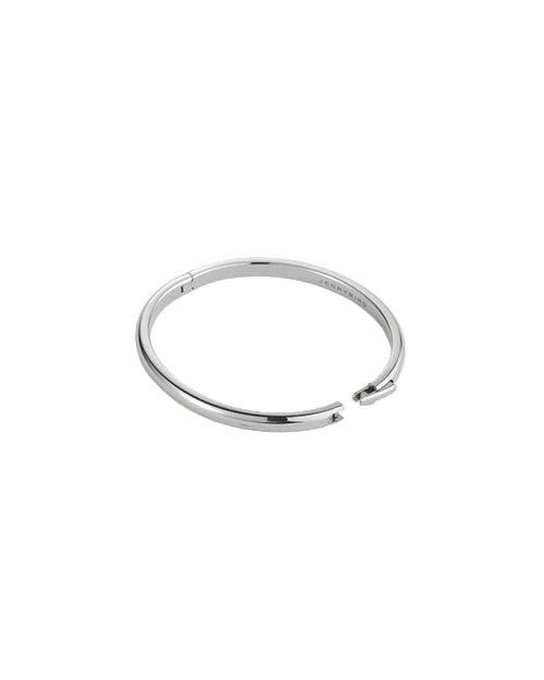A sleek, minimalist silver bracelet with a slightly open design and smooth polished finish, displayed on a light neutral background.
