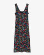 A sleeveless, ankle-length black dress displayed against a plain background. The dress features a colorful floral and botanical print in shades of red, green, blue, and yellow. It has a V-neckline with a delicate black lace trim and a straight silhouette. The fabric appears lightweight and flowy.