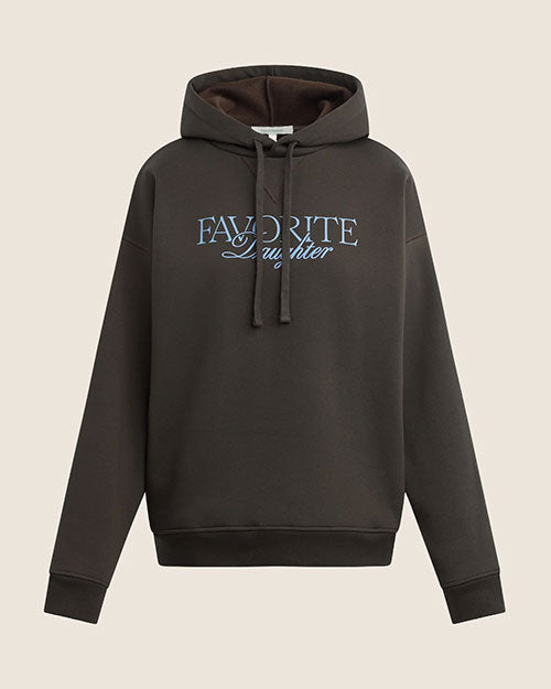 A dark brown oversized hoodie with a drawstring hood and kangaroo pocket. The sweatshirt features the embroidered text “FAVORITE Daughter” across the chest in contrasting white lettering.