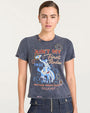 Front view of a short-sleeve, faded black graphic T-shirt featuring colorful rodeo-themed artwork. The design includes a cowboy riding a bucking horse in blue tones, surrounded by decorative circular patterns. Text on the shirt reads ‘Ain’t My First Rodeo,’ ‘1935,’ and ‘Diamond Cross Ranch cinq à sept’ in red, yellow, and white lettering.