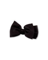 Neatly tied black bow tie with symmetrical loops and tails, typically worn with formal attire such as tuxedos or suits.