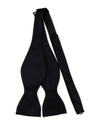 Black self-tie bow tie laid flat, showing its classic shape with wide ends tapering into narrow sections, designed for manual tying.