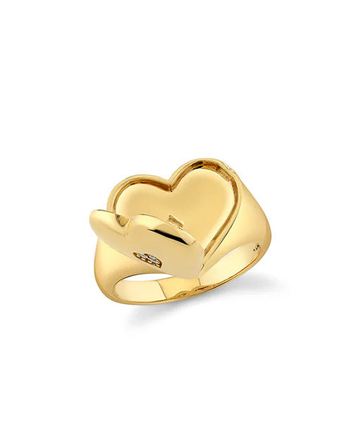 Gold ring with a heart-shaped design featuring a small gemstone embedded in the heart, polished for an elegant finish.