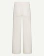 Product image of off-white wide-leg trousers shown from the back against a light background, featuring a high-rise waistband with belt loops and two large square patch pockets. The pants have a structured, tailored silhouette with straight, wide legs and a clean, minimal finish.