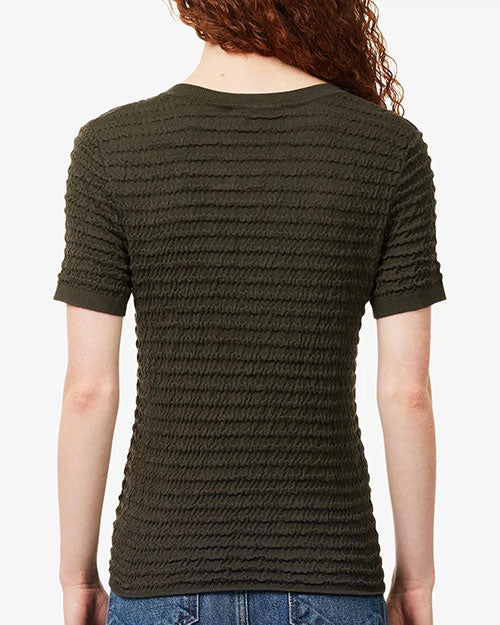 Rear view of a textured knit short-sleeve sweater in a dark olive-brown color. The sweater features a crew neckline, ribbed trim at the neck and sleeves, and an allover wavy horizontal textured pattern. The fitted silhouette falls to the hips and is paired with blue denim jeans. The image is shown against a light gray background.
