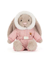 Plush rabbit toy with long floppy ears, dressed in a pink hooded winter outfit with white fur trim, an embroidered orange bell on the chest, matching pink pants, and a white belt.