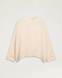Cream long-sleeve blouse with a relaxed fit, crew neckline, and subtle high-low hem.