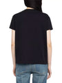 A person shown from the back wearing a plain black short‑sleeve t‑shirt and light blue jeans.