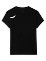 A black short‑sleeve t‑shirt featuring a small white winged brooch near the left shoulder.