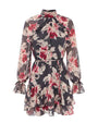 A black and pink floral chiffon mini dress with a high ruffle neckline, long sheer sleeves with tie cuffs, a cinched waist, and a tiered ruffle hem.