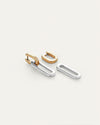Set of two-tone link earrings featuring polished gold and silver elongated oval pieces with a modern, minimalist design, displayed on a light background.