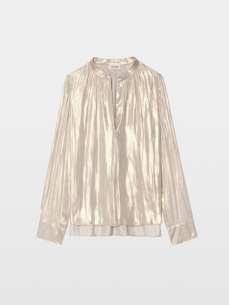 A long‑sleeve, light gold metallic blouse with a subtle sheen, featuring a relaxed fit, gathered neckline, and a V‑shaped front opening.