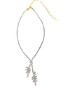 A silver-toned necklace with small crystal stones and a gold chain extender, featuring two dangling branch-like pendants made of stacked metallic bars, displayed on a white background.