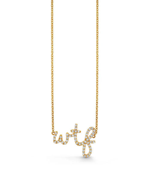 Gold chain necklace with a pendant spelling “wtf” in lowercase letters, encrusted with small sparkling diamonds.