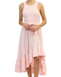 Model wearing a light pink sleeveless dress with a fitted bodice, tied waist sash, and an asymmetrical high-low ruffled skirt, photographed against a white background.