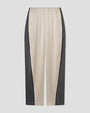 Beige satin pants with dark green side panels and an elastic waistband.