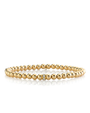 Gold beaded bracelet on a white background