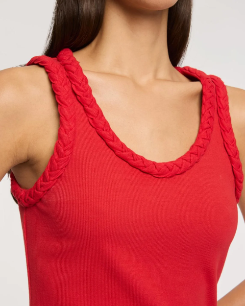 Red tank top with braided straps on a plain background