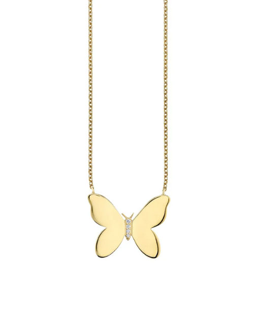 Gold butterfly necklace on a white background