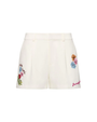 White shorts with floral embroidery on a white background